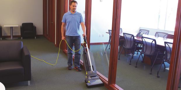 Vacuuming carpets with Karcher CVU Hepa upright vacuum