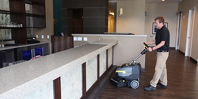 Cleaning hard floor surface with a Karcher BR 35/12 walk-behind compact scrubber