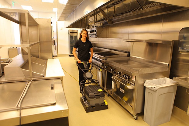 Scrubbing kitchen floor with a Windsor Karcher Group Saber Blade 16 Commercial Cylindrical Automatic Scrubber