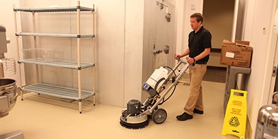 Cleaning kitchen floor with Windsor Karcher Group Taz all-purpose machine