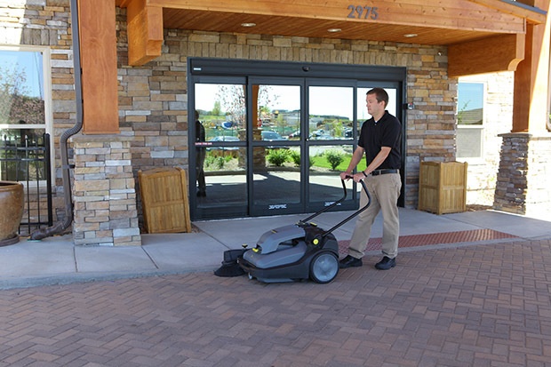Sweeping sidewalk and entry with Windsor Karcher Group Radius 280 Deluxe Battery-Powered Sweeper