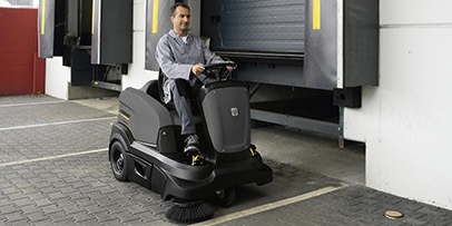 Sweeping loading dock with Karcher ride-on sweeper