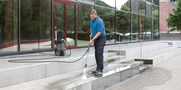 Cleaning building exterior with Karcher HD 1.8/13 cold water pressure washer