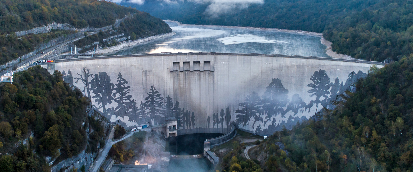 An unparalleled art project - so close to the heavens Picture shows a reverse graffiti art projekt by German artist Klaus Dauven on a dam wall in Vouglans, France.