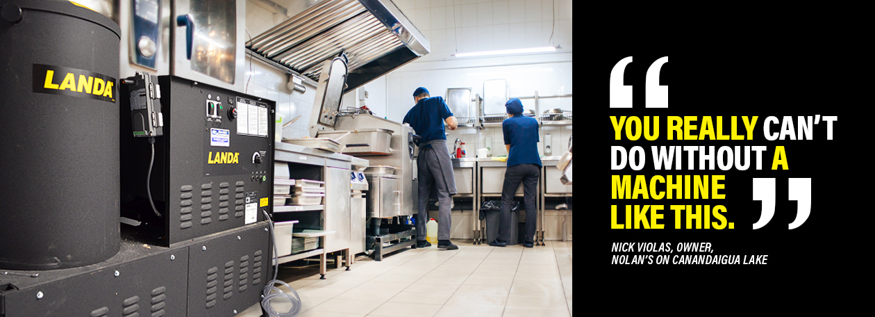 Pressure Washers for Restaurants and Catering Restaurant staff works while a Landa pressure washer sits in the foreground.