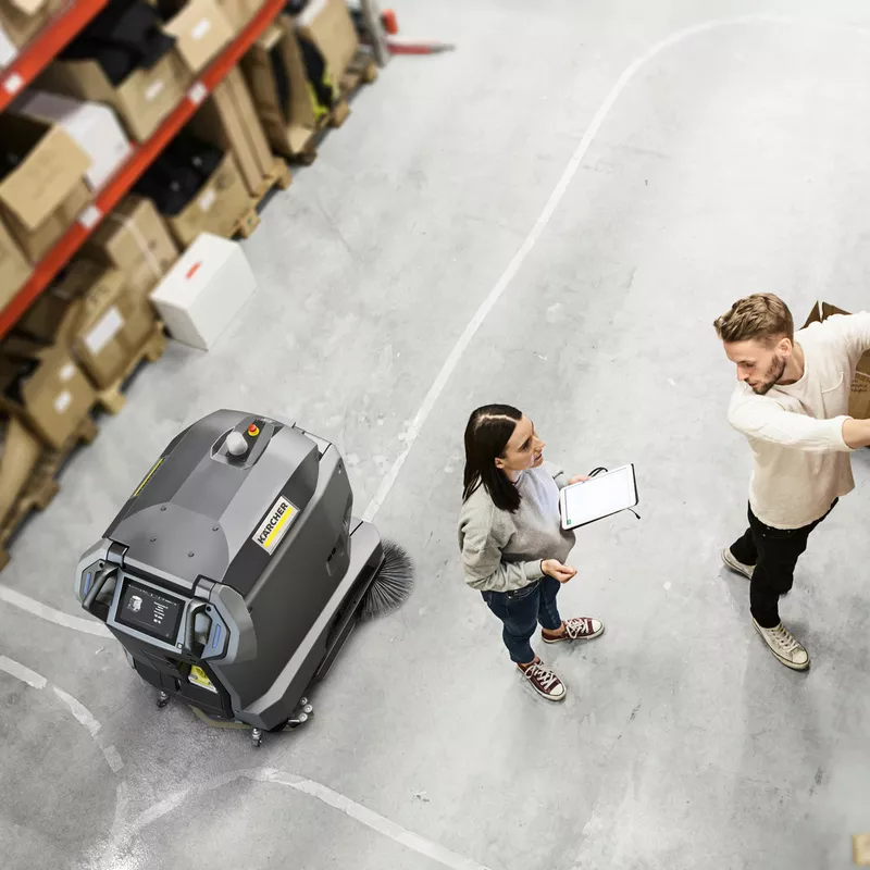 Large-scale floor cleaning in a warehouse with the autonomous Kärcher KIRA B 50 scrubber dryer robot