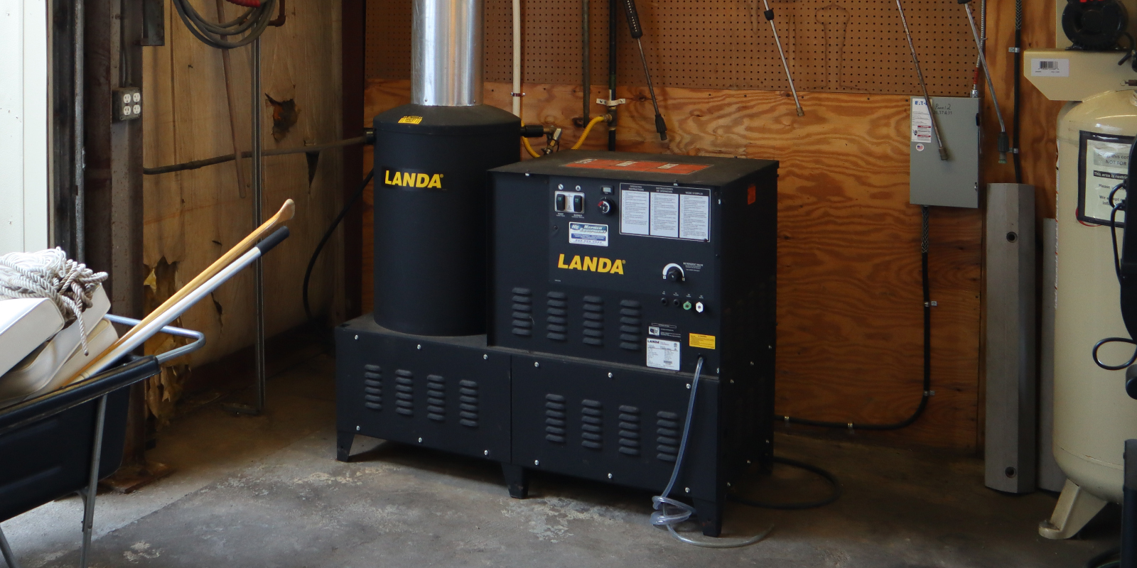 Stationary Electric Hot Water Pressure Washers A Landa VHG stationary electric hot water pressure washer is shown installed inside a facility.