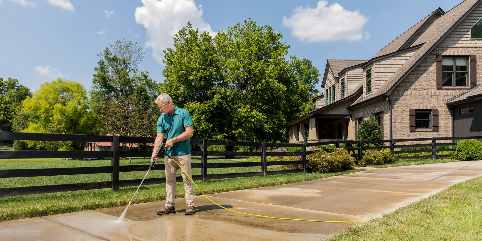 Karcher Gas Pressure Washer Cleans Concrete Driveway Karcher Gas Pressure Washer Cleans Concrete Driveway