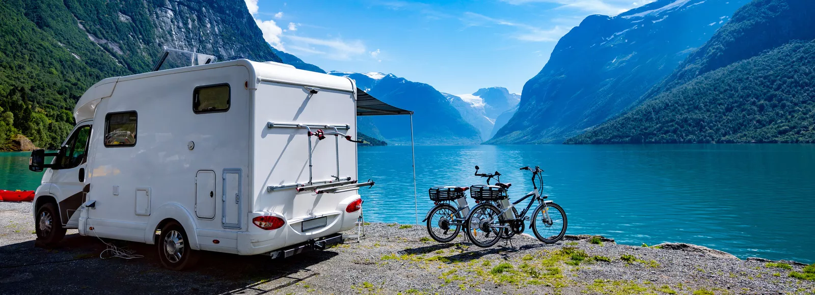 Camping at a mountain lake with a caravan