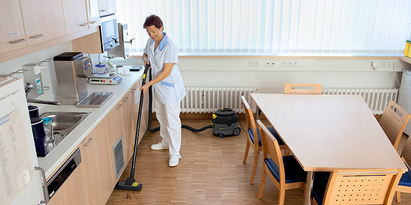 Hospitals and Medical Facilities A worker uses a Kärcher commercial canister vacuum in a medical facility