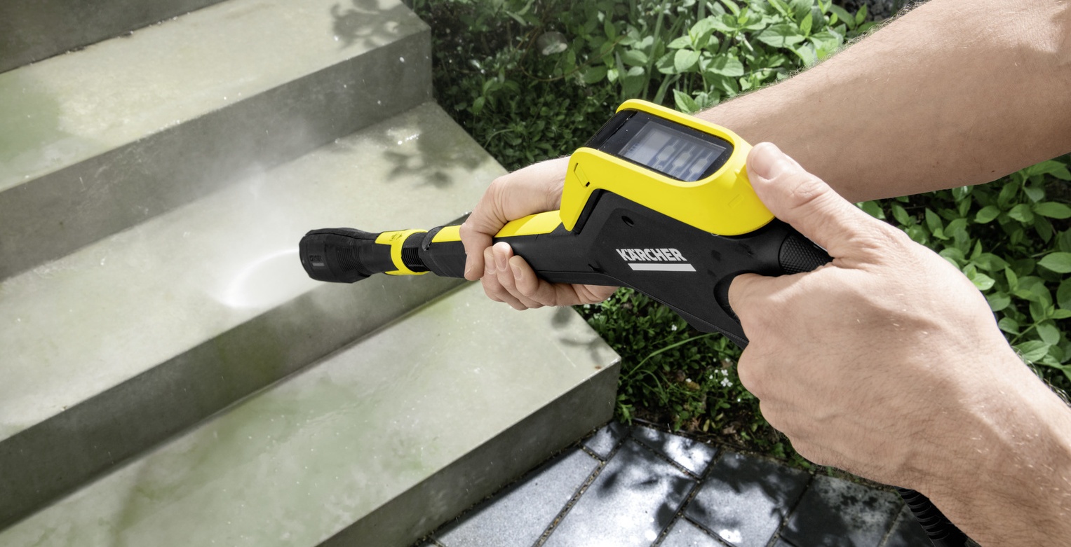 Cleaning mossy paving with a Karcher water blaster Cleaning mossy paving with a Karcher water blaster