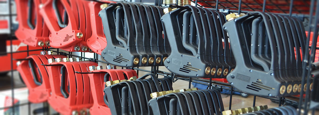 Pressure Washer Accessories Hotsy pressure washer guns displayed in a dealer showroom
