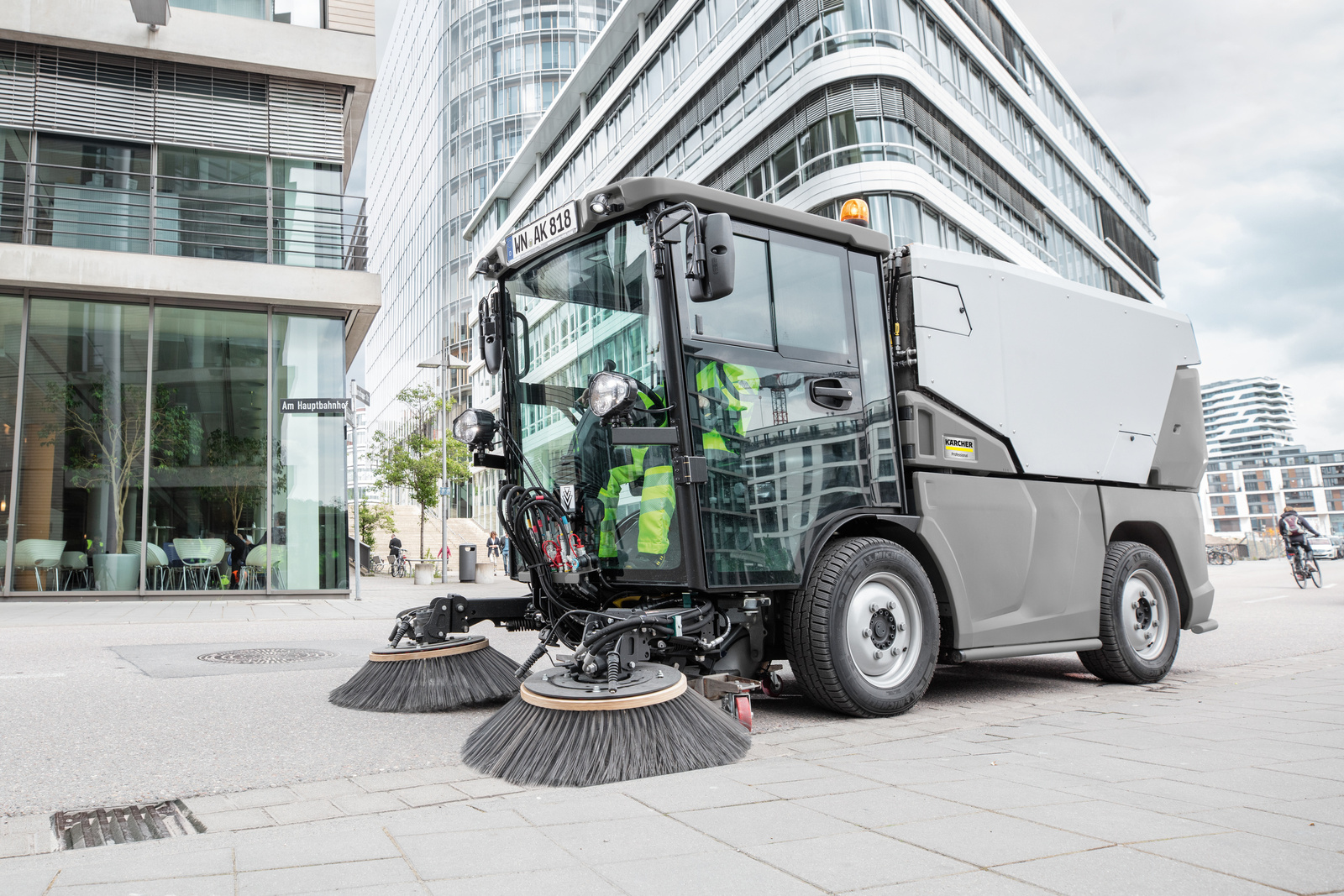 To finance larger purchases for cleaning, an extended term of payment can be used A sweeper surrounded by modern architecture