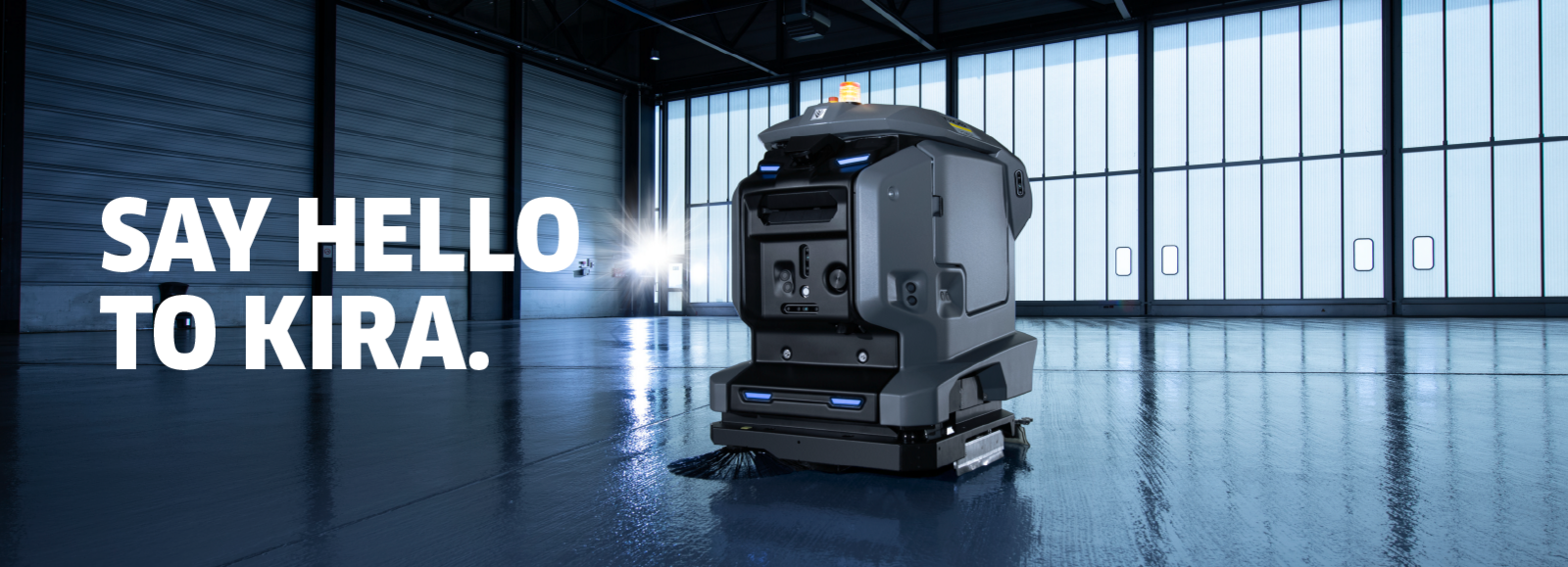 Man seen cleaning a linoleum floor using a Kärcher scrubber dryer