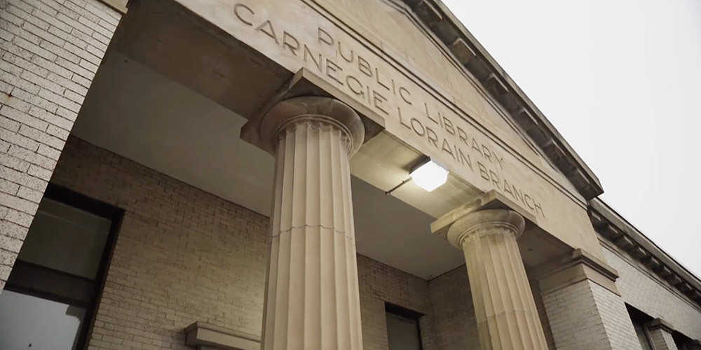 Exterior of Carnegie Lorain Library Looking up at the Greek-inspired columns and entablature
