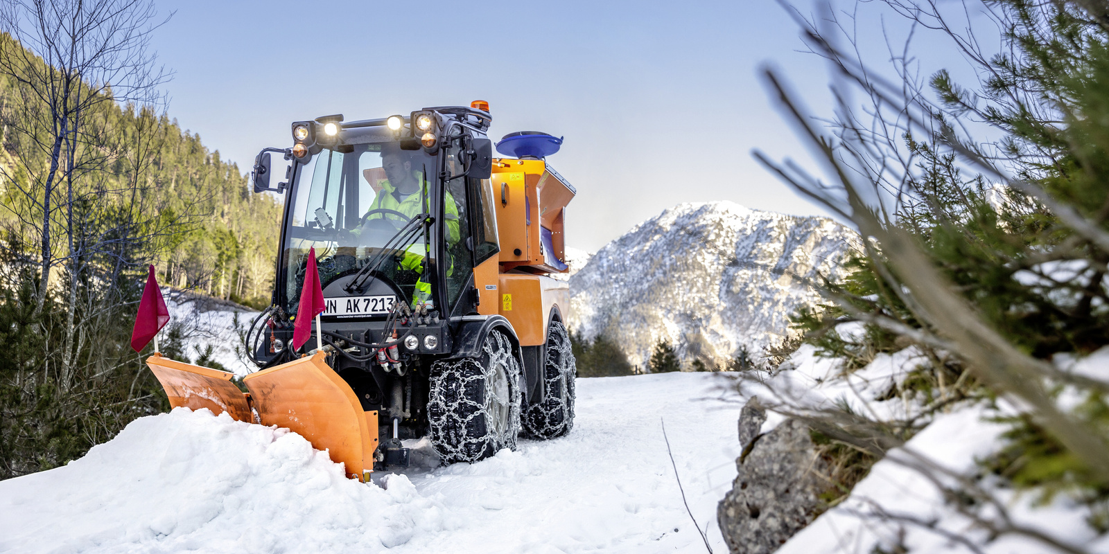 Snowplough A snowplough pushing large masses of snow from a mountain road