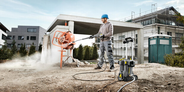 Kärcher Electric Cold Water Pressure Washers A worker cleans a cement mixer using a Kärcher Electric Cold Water Pressure Washer