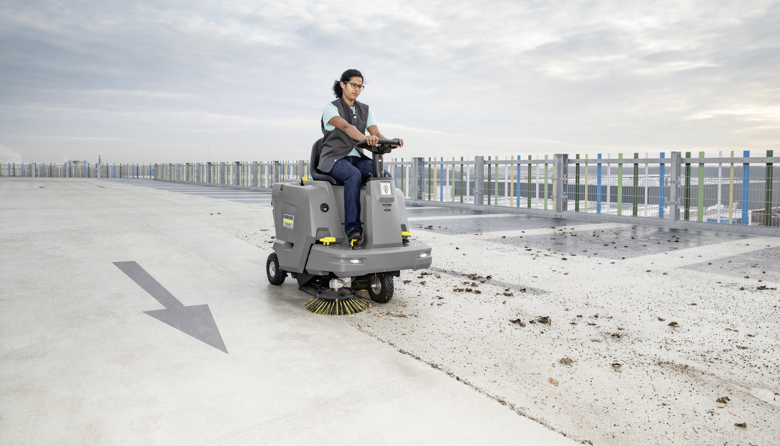 Kärcher vacuum sweeper a cleaning professional cleaning a parking deck with a vacuum sweeper