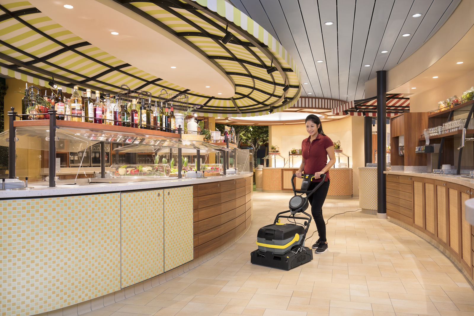 Scrubber dryer in use A person cleaning the floor with a scrubber dryer