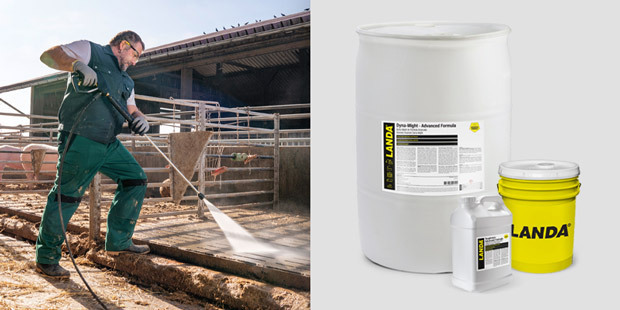 A man pressure washes concrete areas on a farm