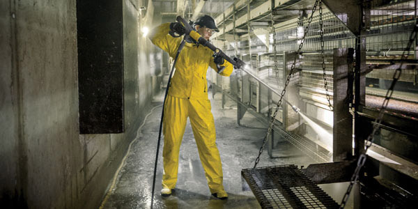 No Exhaust Emissions A worker uses an en electric pressure washer with no exhaust emissions