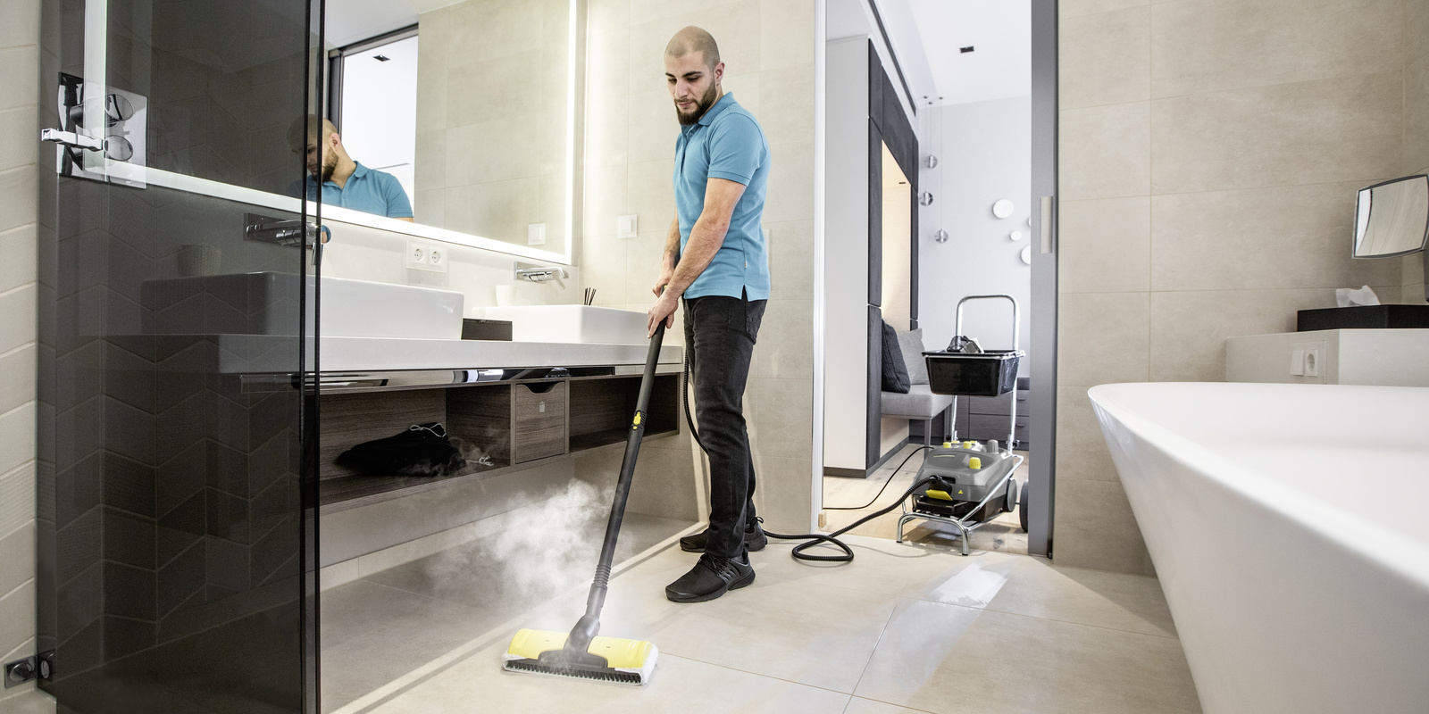 Bathroom cleaning A person cleans the bathroom of a hotel room
