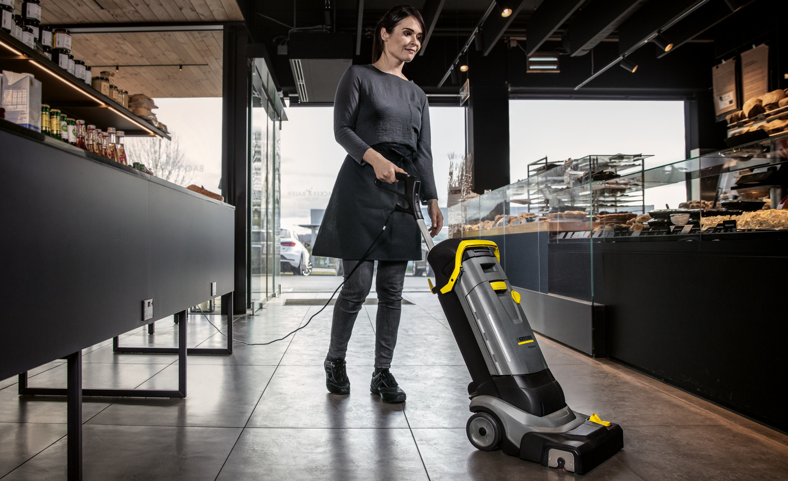 Cleaning a bakery A person cleaning the sales area of a bakery