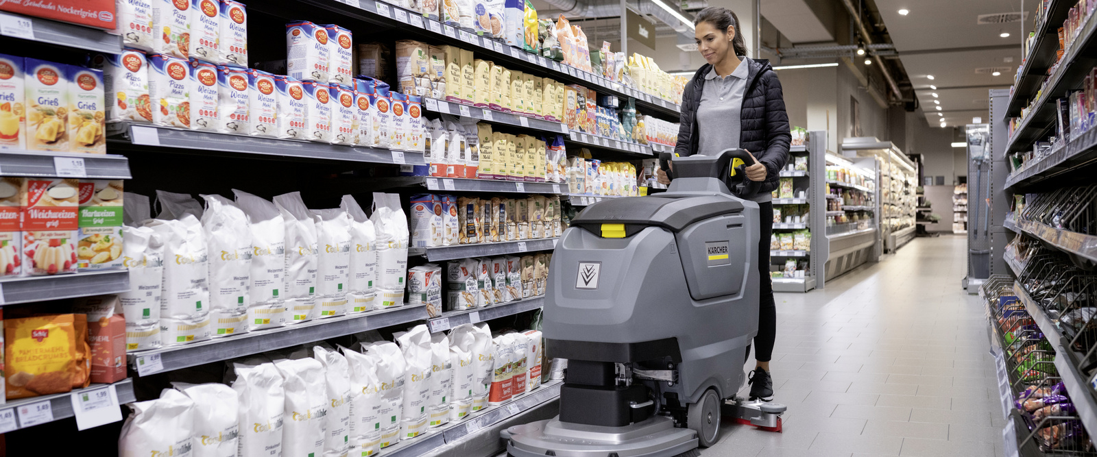 Scrubber dryer in use A person cleaning the floor with a scrubber dryer