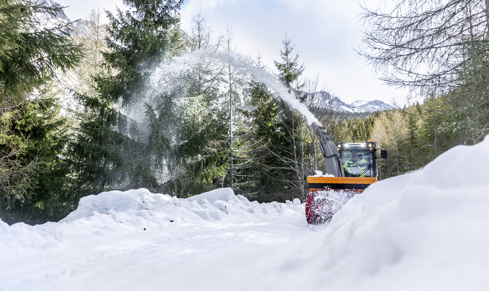 Winter service A snow blower clearing a path from snow