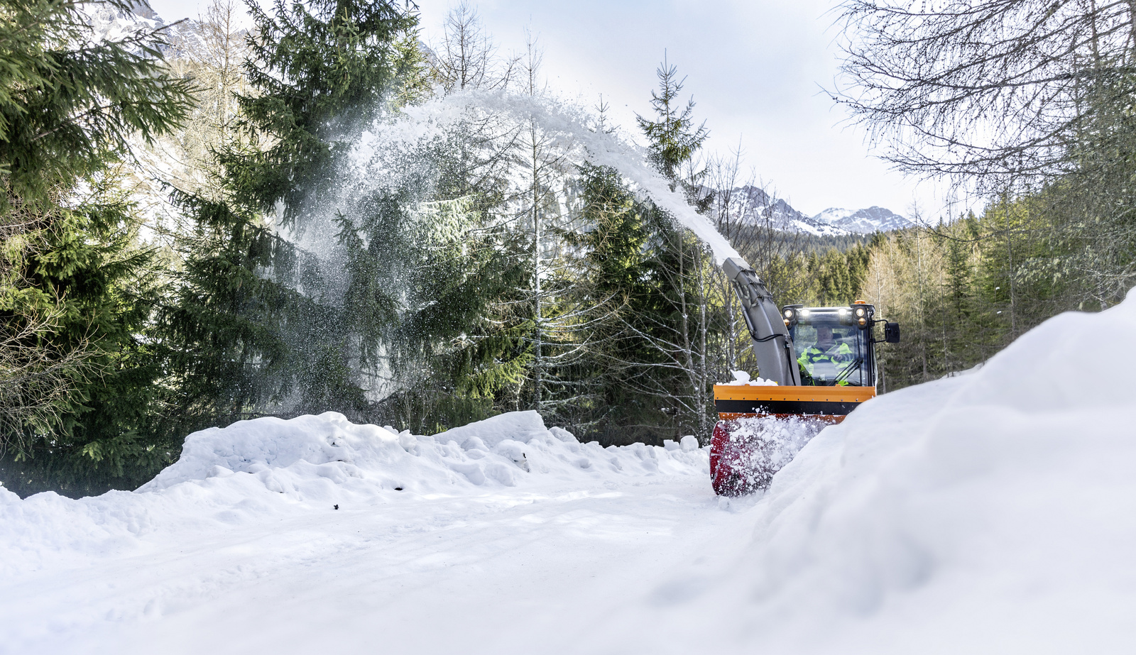 Winter service A snow thrower clearing a path from snow