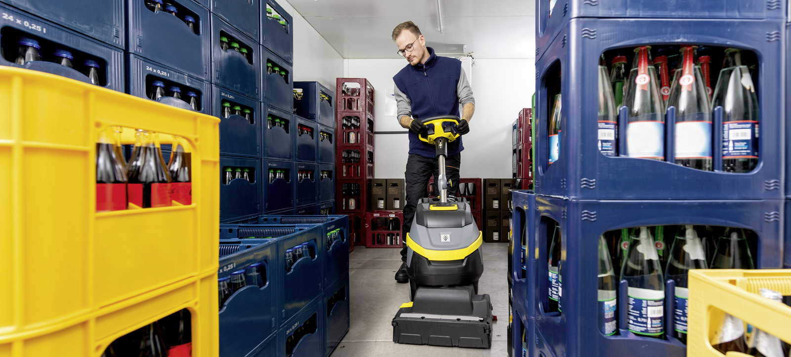 Cleaning cold stores A person is cleaning a cold storage room with a scrubber dryer