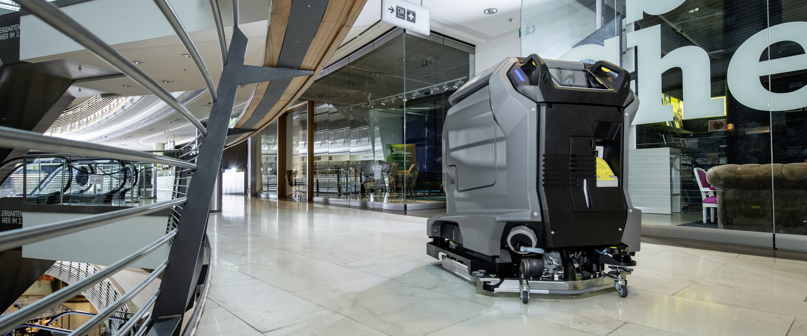 Vacuum robots in use A robot vacuum cleaner cleans the floor of a shopping mall