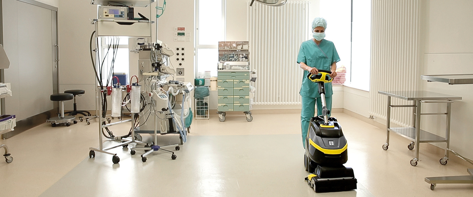 Floor cleaning in the operating room A person cleans the floor of an operating room