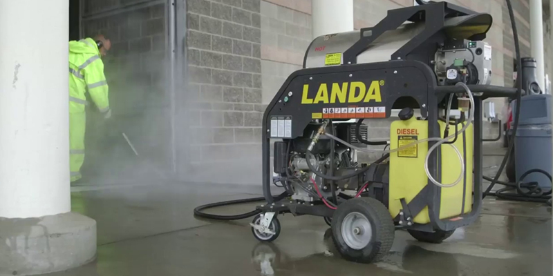 Sanitation and Hygiene A worker uses a Landa MHC gas-powered pressure washer to clean in a baseball stadium