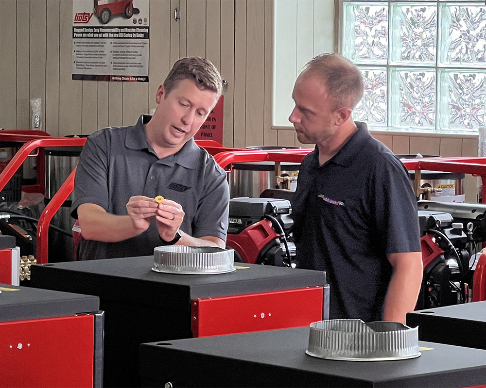 A Hotsy dealer helps a customer select the right pressure washer