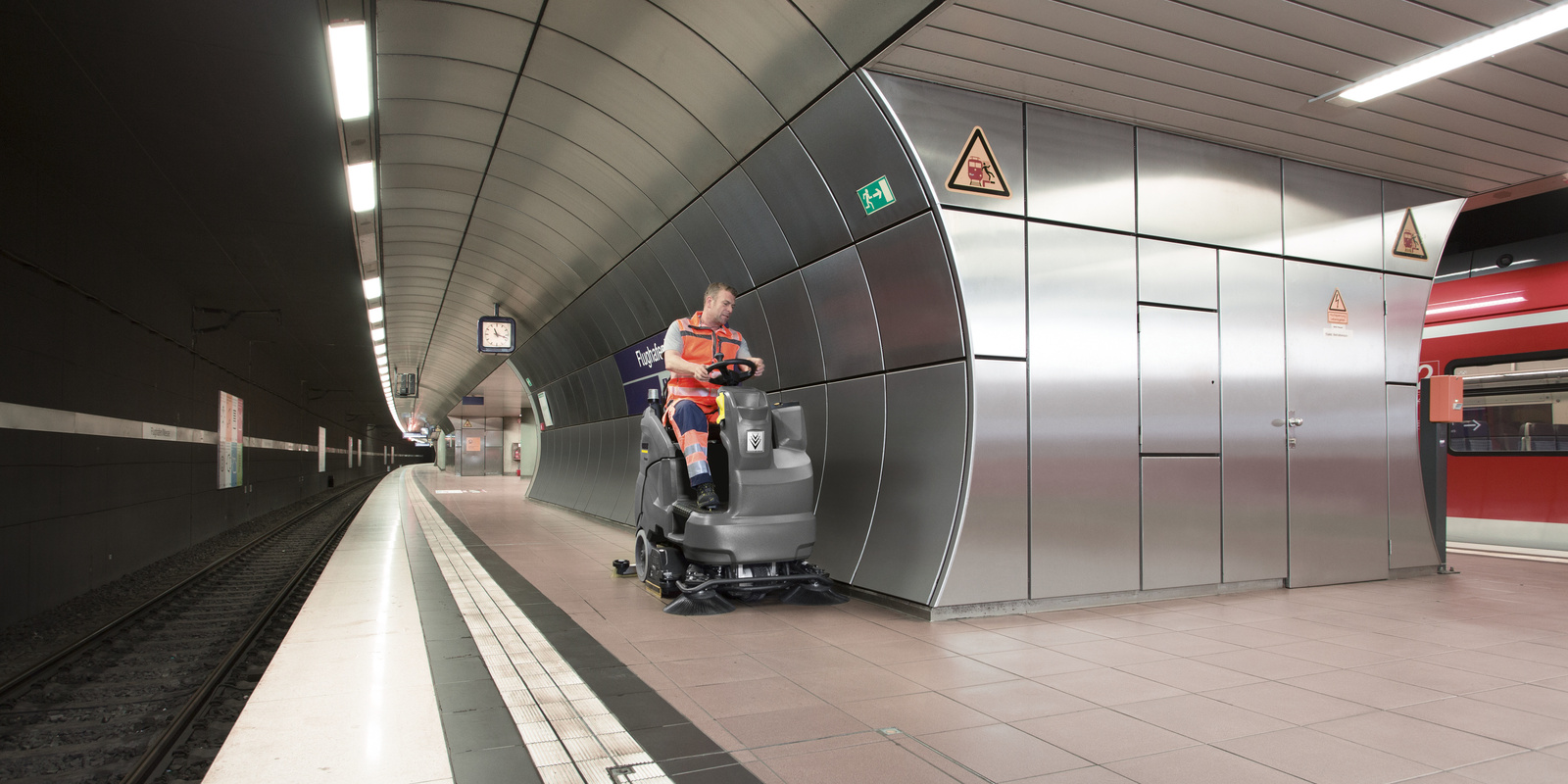 Ride-on vacuum sweeper in use The Kärcher ride-on vacuum sweeper in use