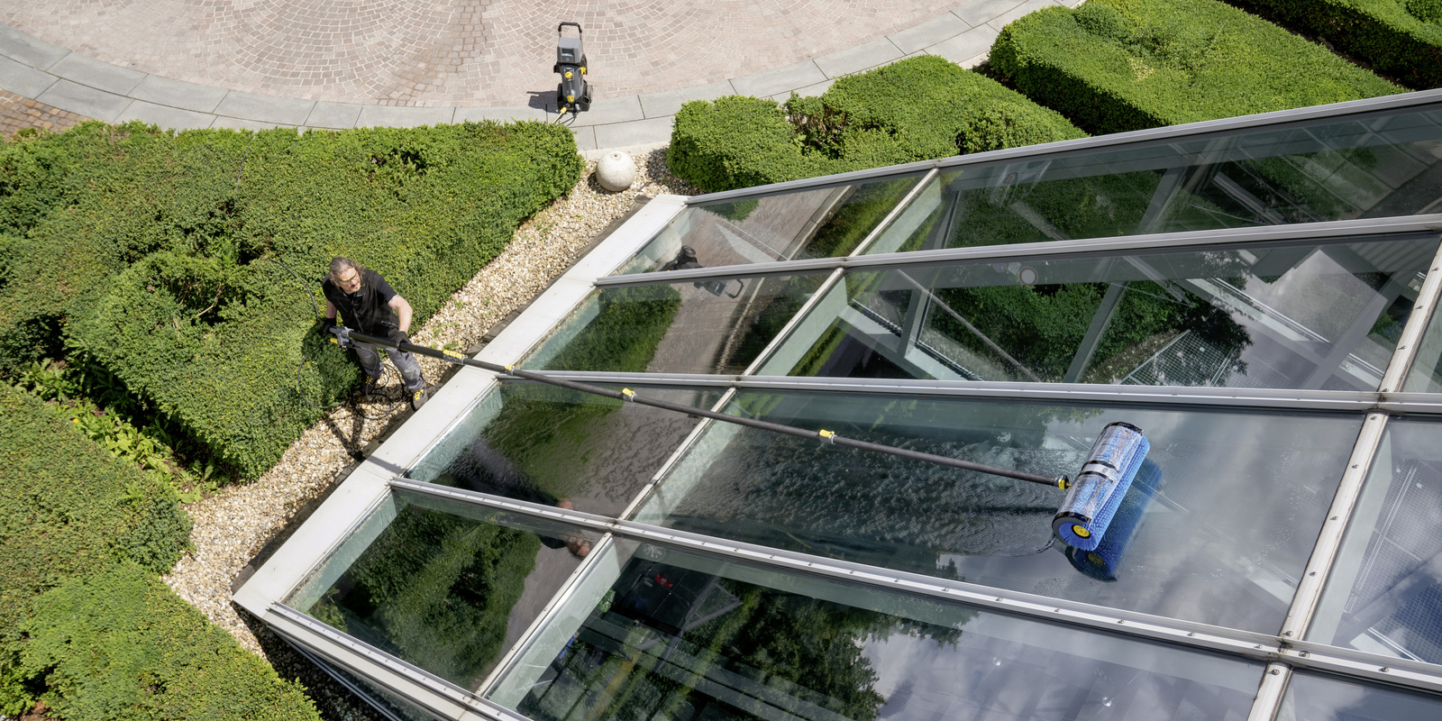 Cleaning the glass facade A person cleaning the glass facade