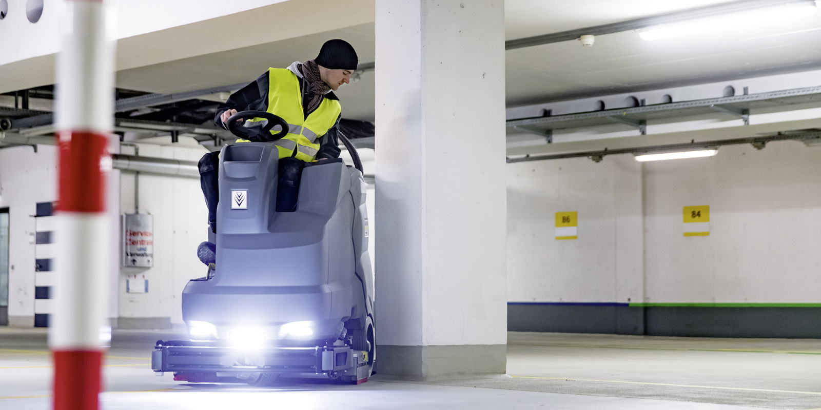 The Kärcher ride-on sweeper in use The Kärcher ride-on sweeper in use
