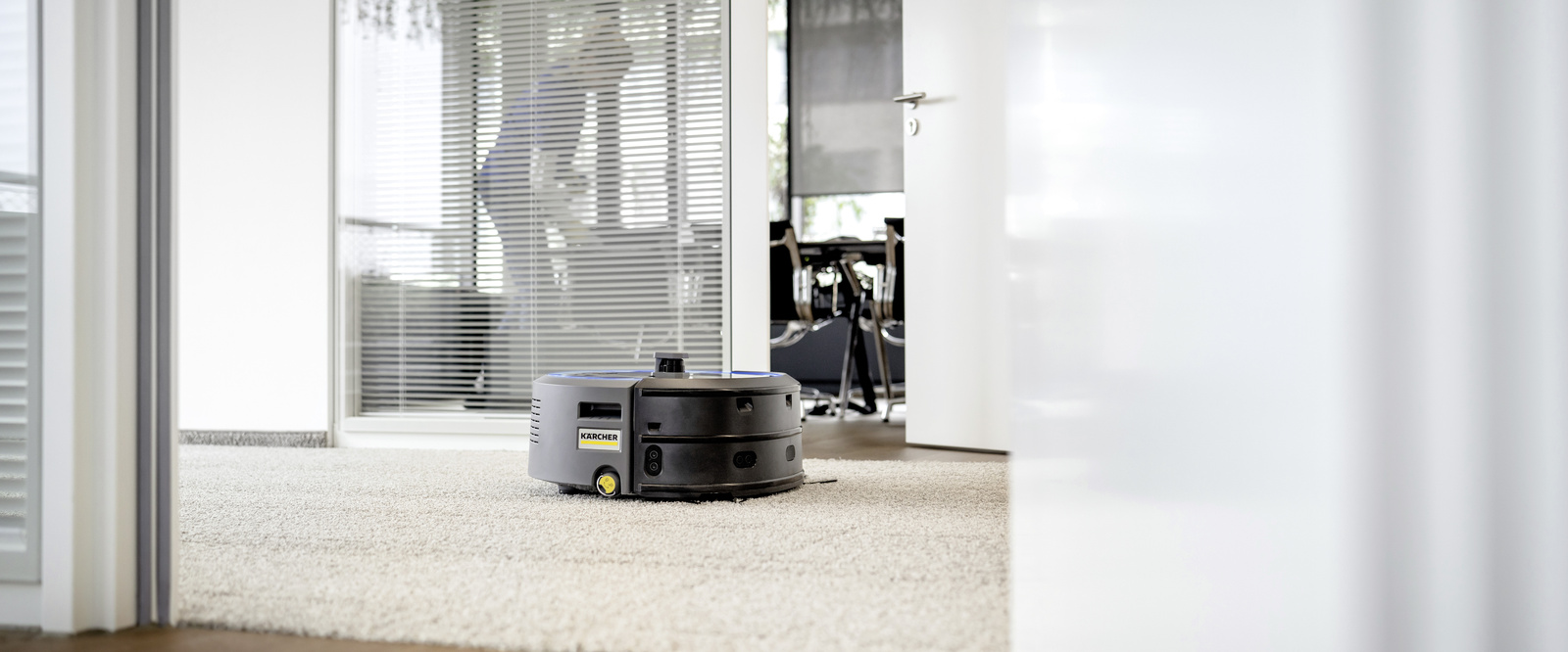 Vacuum robot KIRA in use The vacuum robot KIRA cleaning the floor