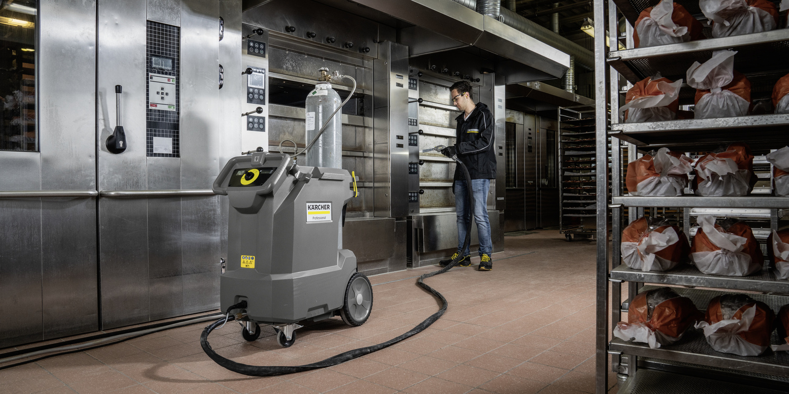 Gentle cleaning with dry ice A person gently cleans surfaces with the dry ice blasting machine