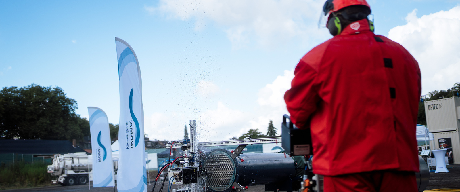 Heat exchanger cleaning A man cleans a heat exchanger using a Kärcher cleaning solution