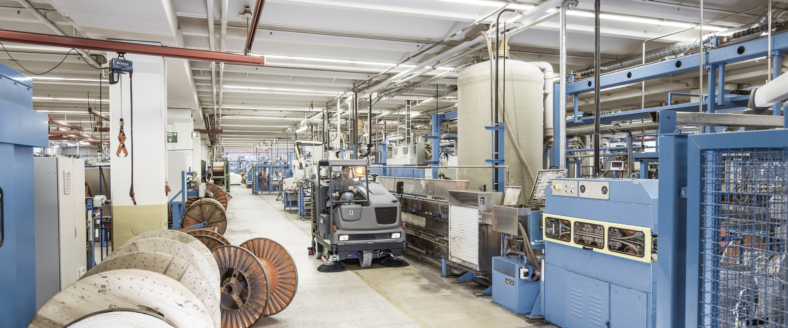 General cleaning tasks in industry General cleaning tasks in industry: A person cleans the floor in the facility