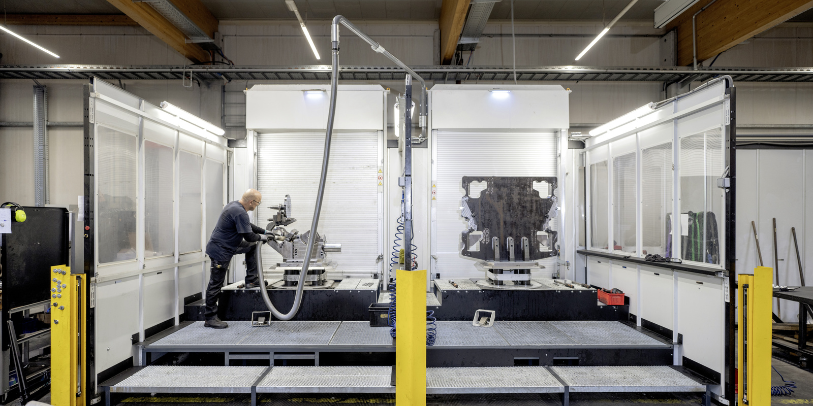 Extraction system in the automotive industry A man operates an extraction system in the automotive industry