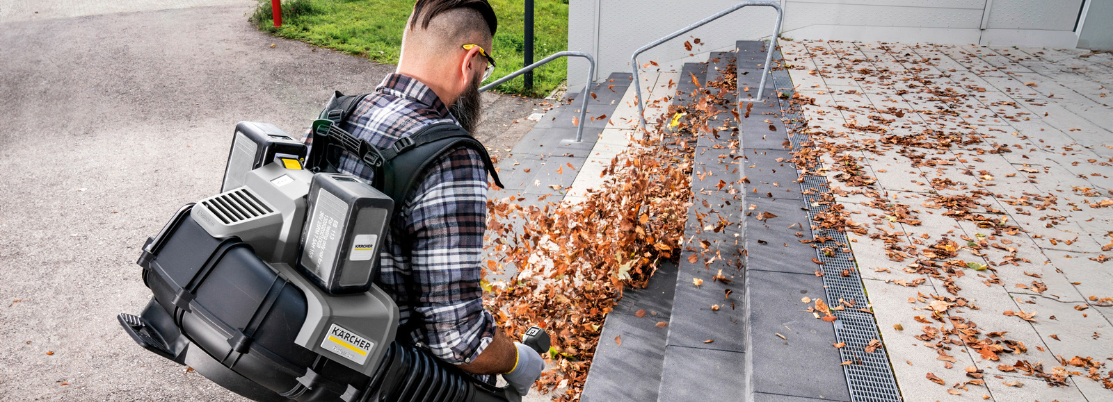 Leaf blower in use A person operating a leaf blower