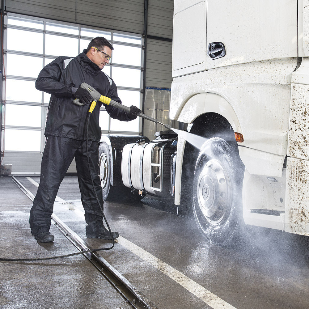 Cold Water Electric Pressure Washers A worker pressure washes a semi truck cab with a cold water electric pressure washer