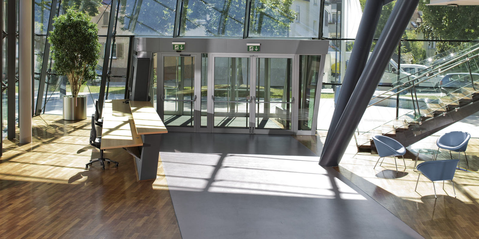 Cleaning Reception Areas Photograph shows the indoor entrance area of a corporate office.