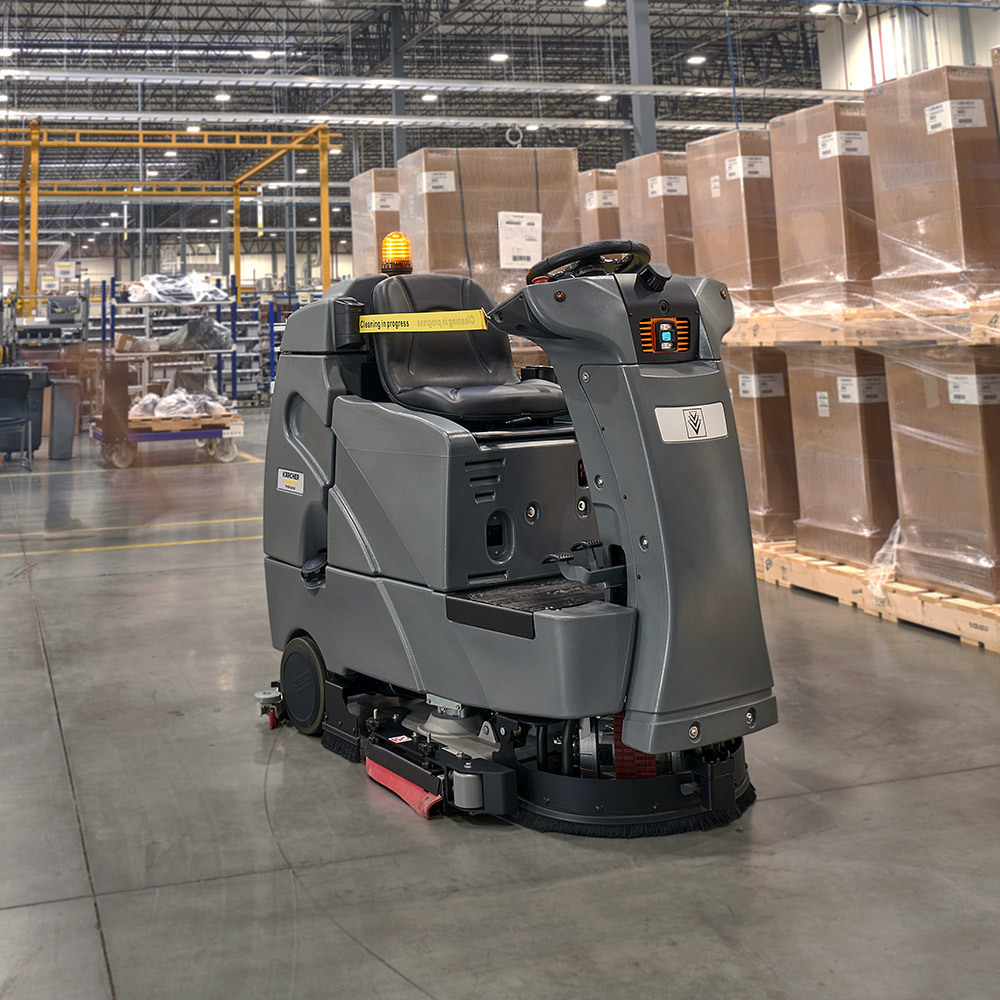 KIRA B 100 R Autonomous Scrubber A KIRA B 100 R Scrubber cleans floors in a warehouse.