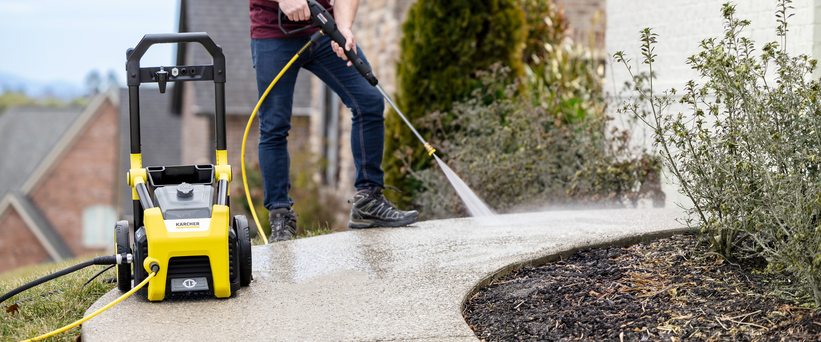 Karcher K2100PS Pressure Washer Cleans Sidewalk Karcher K2100PS Pressure Washer Cleans Sidewalk