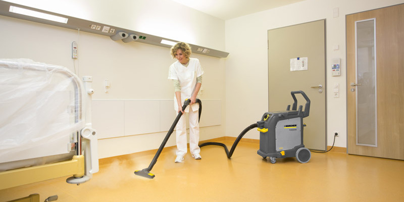 Cleaning Solutions for Healthcare Facilities A worker uses a Kärcher Steam Cleaner to disinfect hospital floors