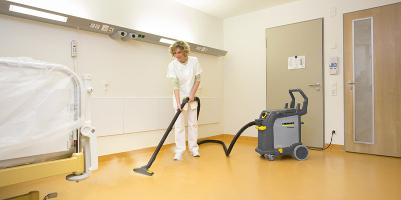 Cleaning Solutions for Healthcare Facilities A worker uses a Kärcher Steam Cleaner to disinfect hospital floors